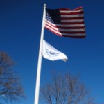 ILCNSA Flag flying below US Flag in front of House of Seven Gables on April 3, 2012 to celebrate 25th Birthday Celebration