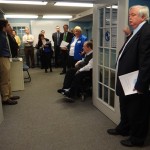 Attendees listen intently as Massachusetts Rehabilitation Commission Commissioner Charles Carr speaks